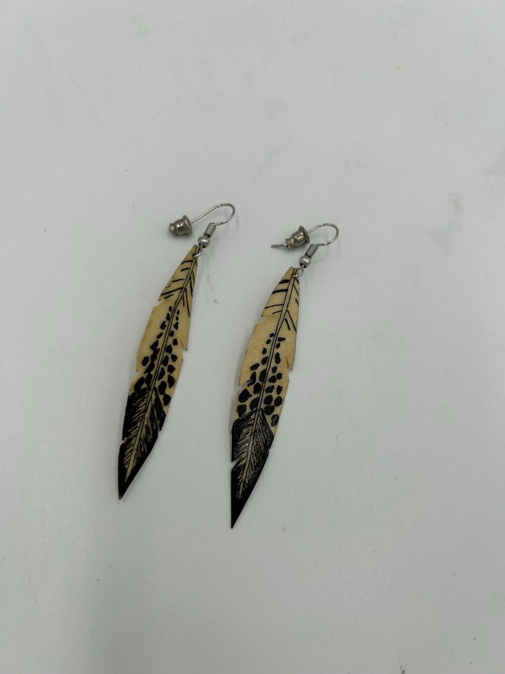 Stunning hand-carved buffalo bone feather earrings by Geronimo Menke in 2018